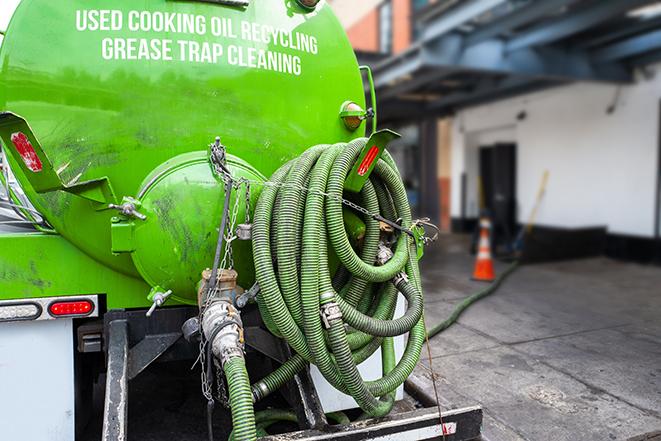 a professional service truck pumping a grease trap in Avila Beach